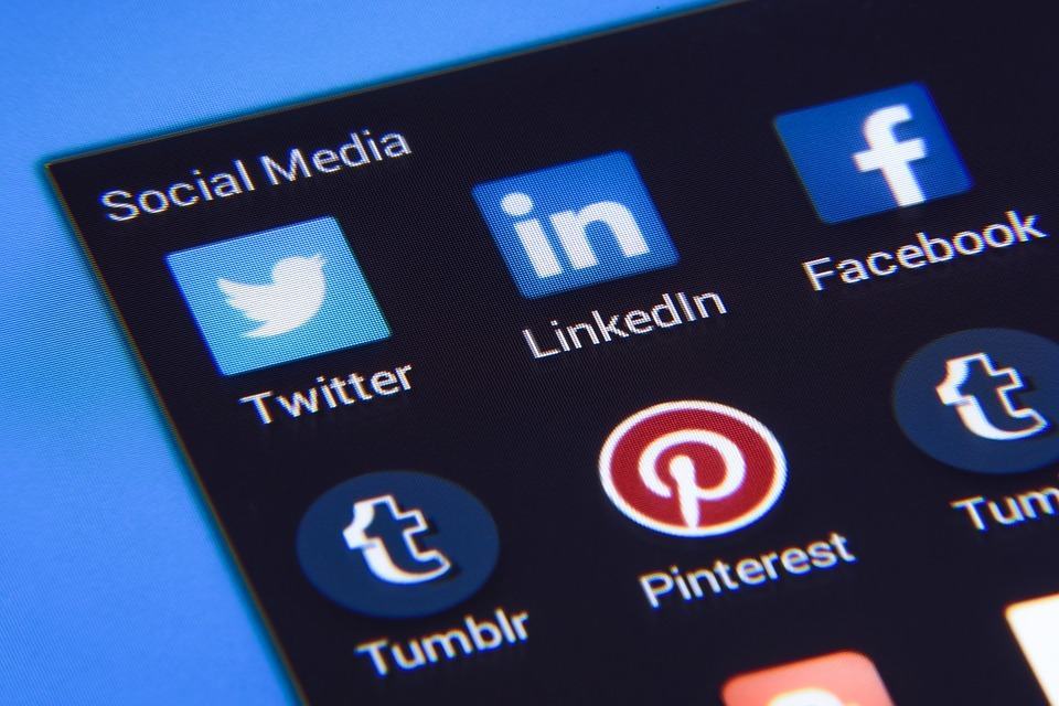 Close-up of social media app icons including Twitter, LinkedIn, Facebook and Pinterest on a smartphone screen