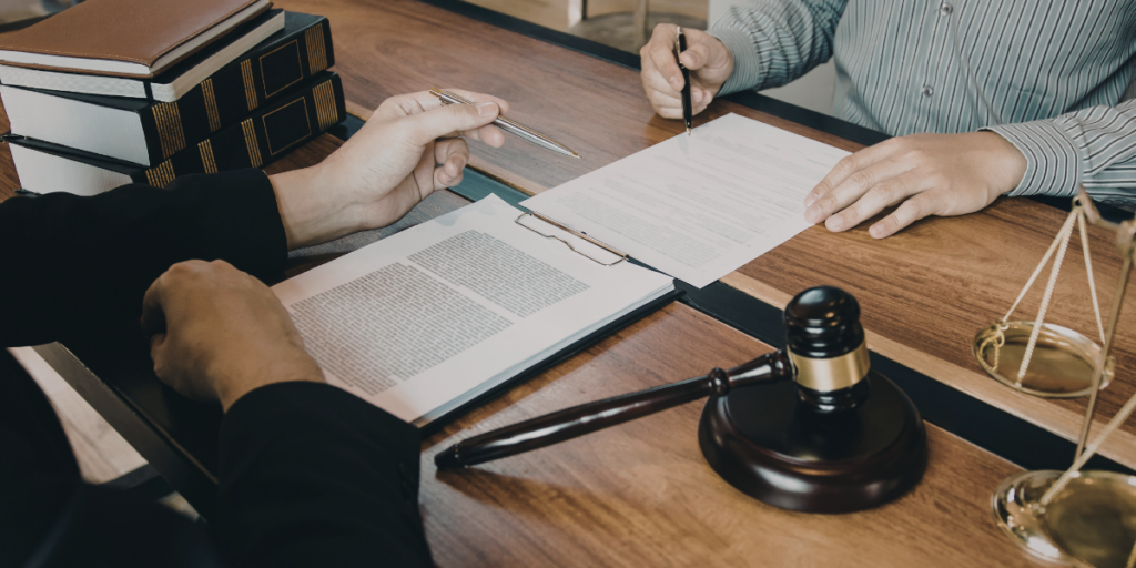 Two people reviewing legal documents