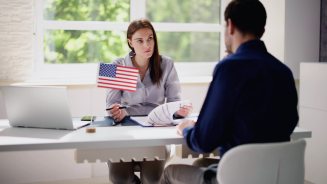 Woman holding a small US flag