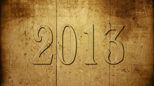 The year 2013 engraved in aged gold textured metal, illustrating online marketing predictions for 2013