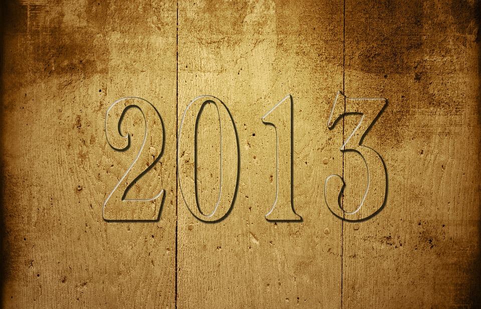 The year 2013 engraved in aged gold textured metal, illustrating online marketing predictions for 2013
