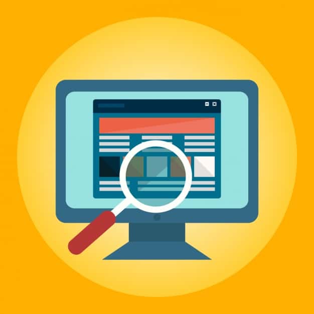Magnifying glass over a website on a computer monitor, illustrating SEO audit and bad habits to break