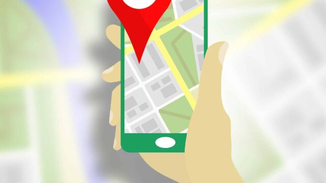 Illustrated hand holding a smartphone with a map pin on a street map, representing local SEO campaigns