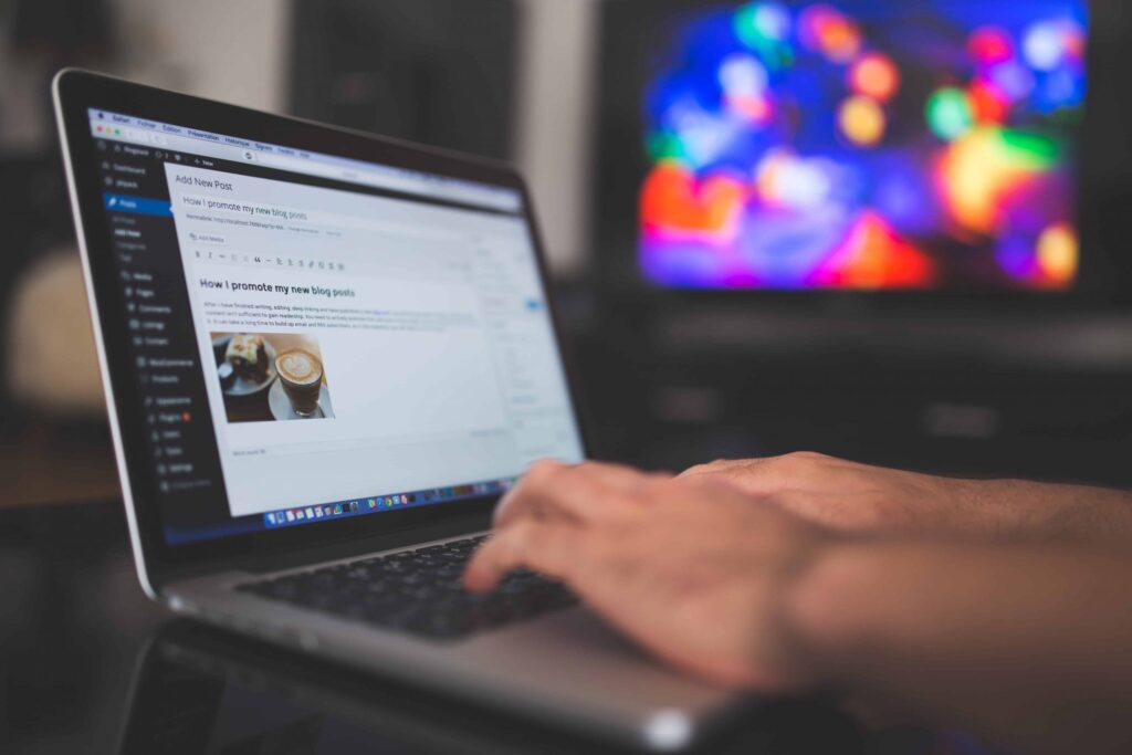 Writing a blog post about promoting a new blog post in a laptop