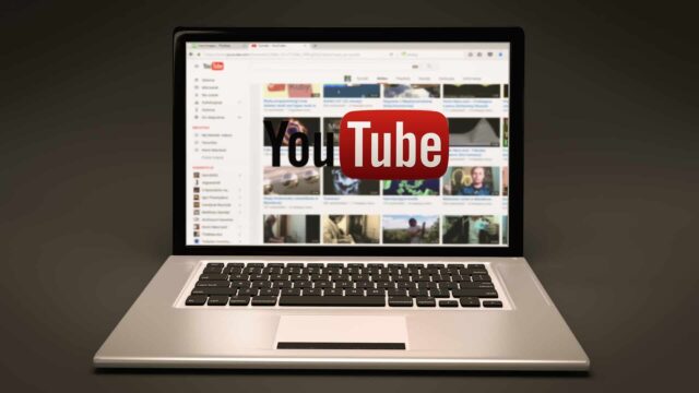 YouTube homepage on a laptop screen with YouTube logo, illustrating YouTube SEO ranking factors article