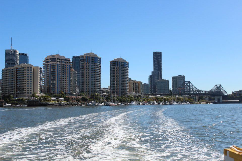 Brisbane city skyline and Story Bridge viewed from the river on a sunny day