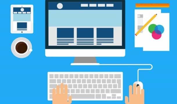Flat design illustration of hands at a keyboard and mouse in front of a desktop monitor showing a website layout