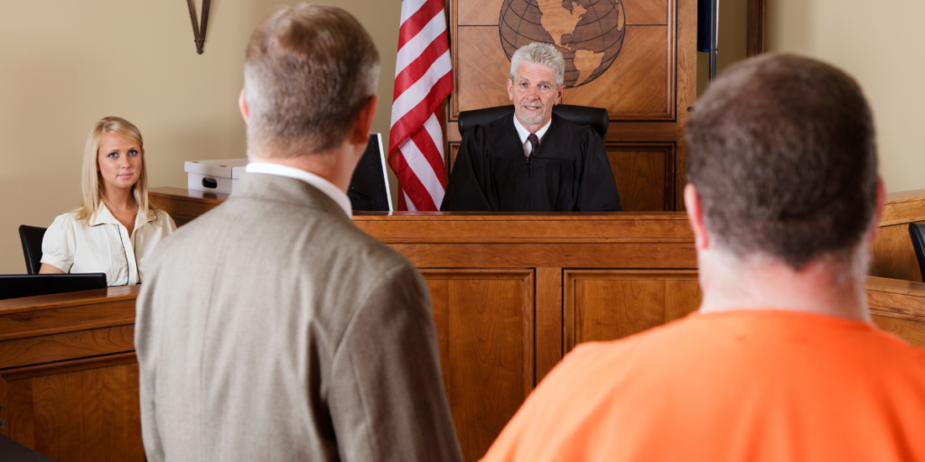 Judge presiding over courtroom scene with lawyers and defendant, representing digital marketing for criminal lawyers