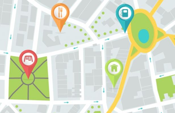 Illustrated city map with colourful location pins for restaurant, fuel, home and shopping, representing Google Maps