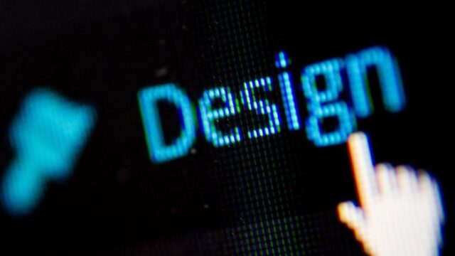 Close-up of the word Design on a dark digital screen with a cursor hand pointer hovering over it