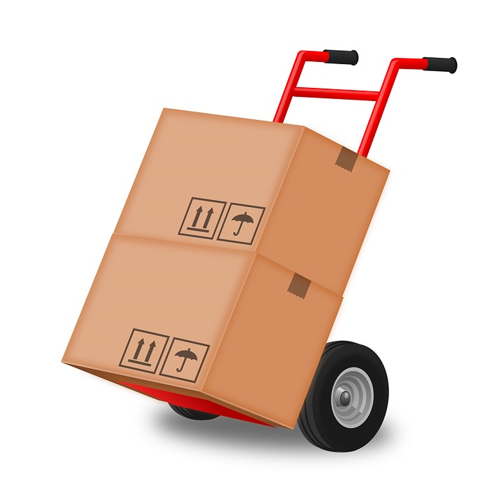 Illustration of a red hand truck loaded with two cardboard shipping boxes, representing an office move
