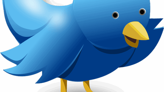Cartoon Twitter bird mascot in blue with yellow beak and feet on white background