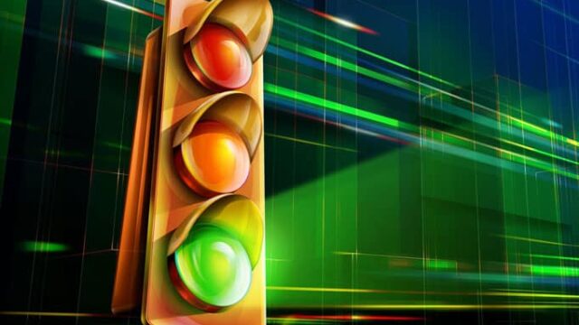 Traffic light showing green at the bottom against a digital green background, representing Yoast SEO green circle scoring