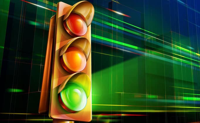 Traffic light showing green at the bottom against a digital green background, representing Yoast SEO green circle scoring